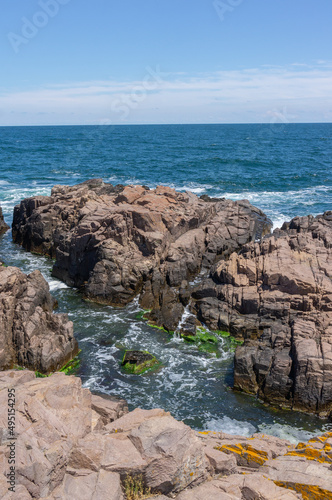 Sea surf day landscape. Sea waves with white foam breaks on stones. Sozopol. Bulgaria