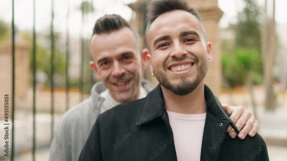 Young couple smiling confident standing together at street