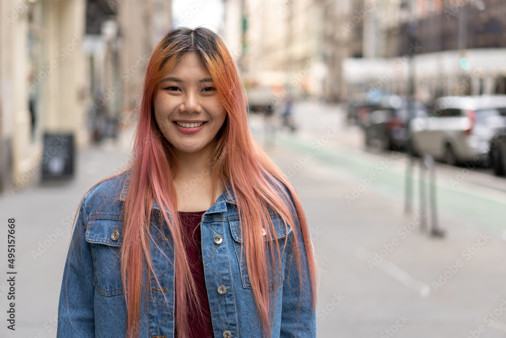 Young Asian woman with pink hair smile happy face portrait Young Asian woman with pink hair smile happy face portrait