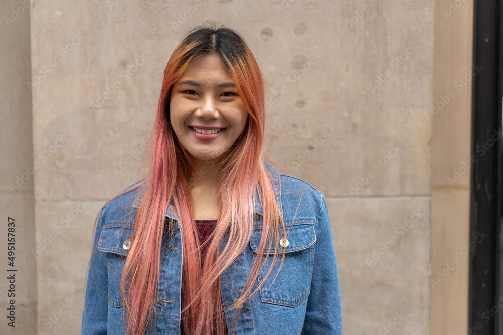 Young Asian woman with pink hair smile happy face portrait Young Asian woman with pink hair smile happy face portrait