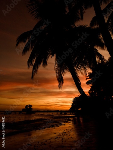 Sunset in Paradise with Palmtrees on the Beach 