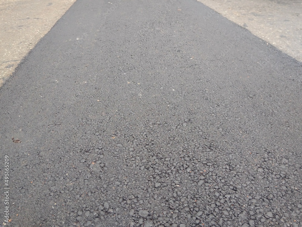 Obraz premium Brand new asphalt pavement low angle background