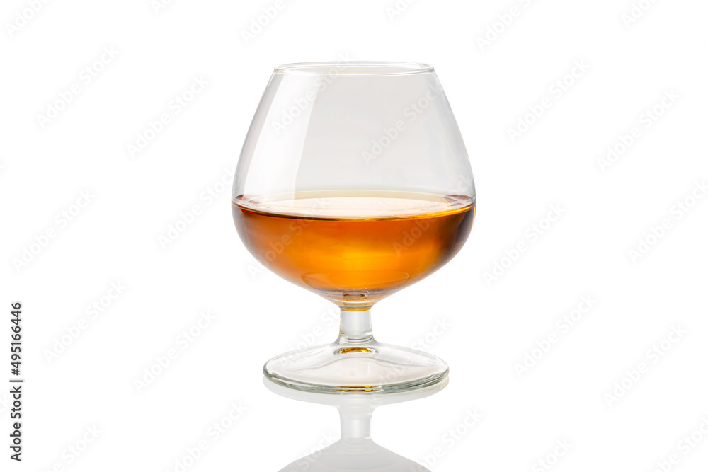 French cognac or brandy into glass called napoleon isolated on white, clipping path French cognac or brandy into glass called napoleon isolated on white, clipping path