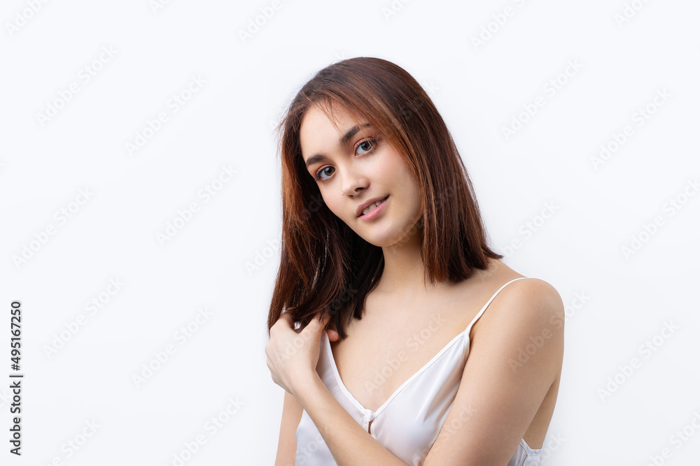 Beautiful smiling woman with clean skin, natural make-up and white teeth on a gray background Beautiful smiling woman with clean skin, natural make-up and white teeth on a gray background