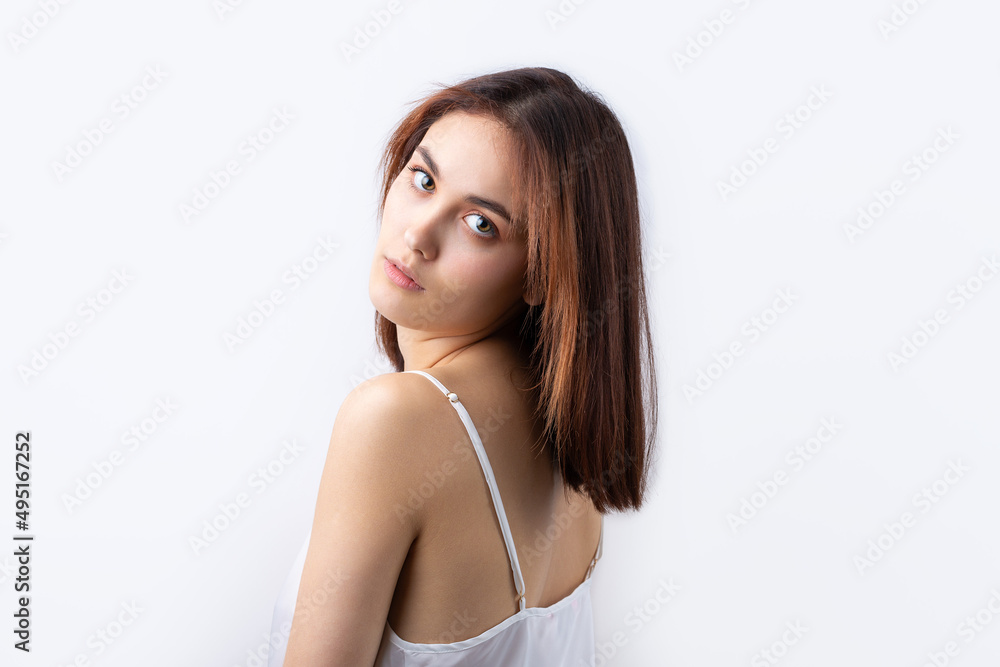 Beautiful smiling woman with clean skin, natural make-up and white teeth on a gray background Beautiful smiling woman with clean skin, natural make-up and white teeth on a gray background