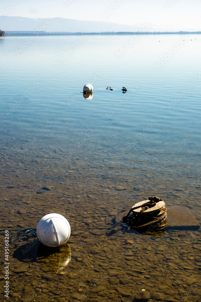 Obraz premium A floating ship buoy near the port, serves as a floating anchor for ships