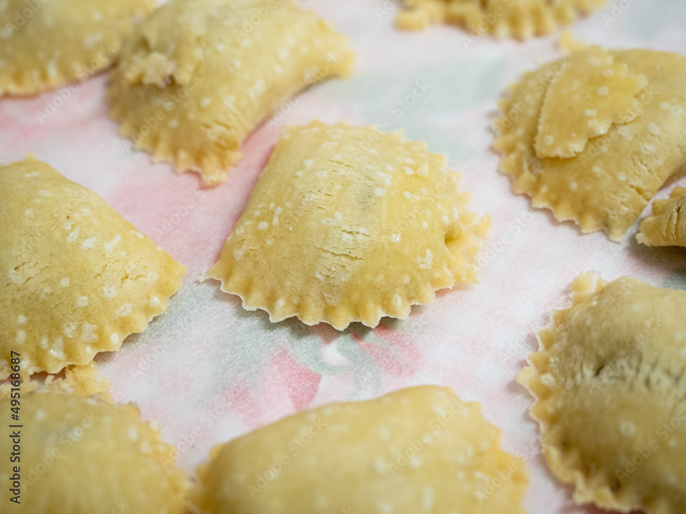 Homemade ravioli are filled with delicious fillings and are waiting to be cooked.
Homemade ravioli are filled with delicious fillings and are waiting to be cooked.