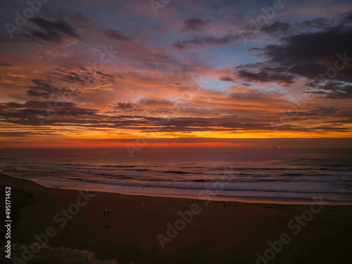 Dawn reflections and clouds at the seaside with lagoon