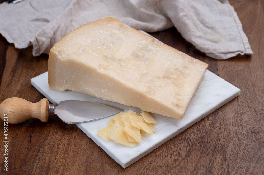 Flakes of parmesan cheese, italian hard parmigiano-reggiano cheese from Reggio Emilia region