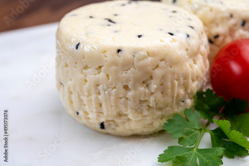 Traditional polish white cheese with black chives seeds made in North Poland in Kaszebe area near Gdynia. photo