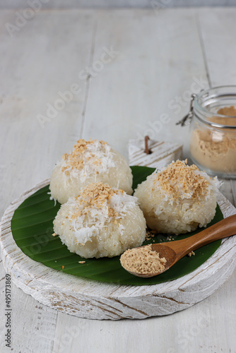 Ketan bubuk kedelai or Steamed sticky rice with soybean powder. photo