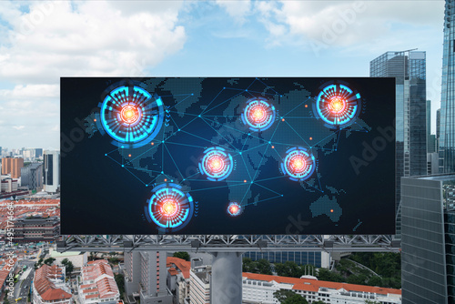 World planet Earth map hologram on billboard over panorama city view of Singapore. The concept of international connections and business in Southeast Asia.
