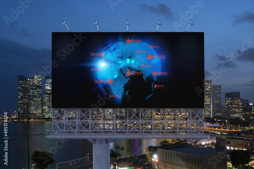 Hologram of Earth planet map on billboard over night panoramic cityscape of Singapore. The concept of international companies in Southeast Asia. Globe