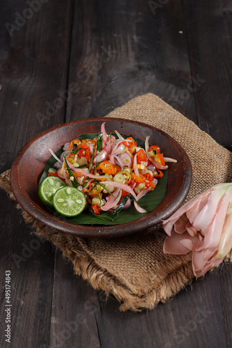 Sambal Bongkot kecombrang is raw Balinese sambal from chili, onion and bongkot or torch ginger. photo