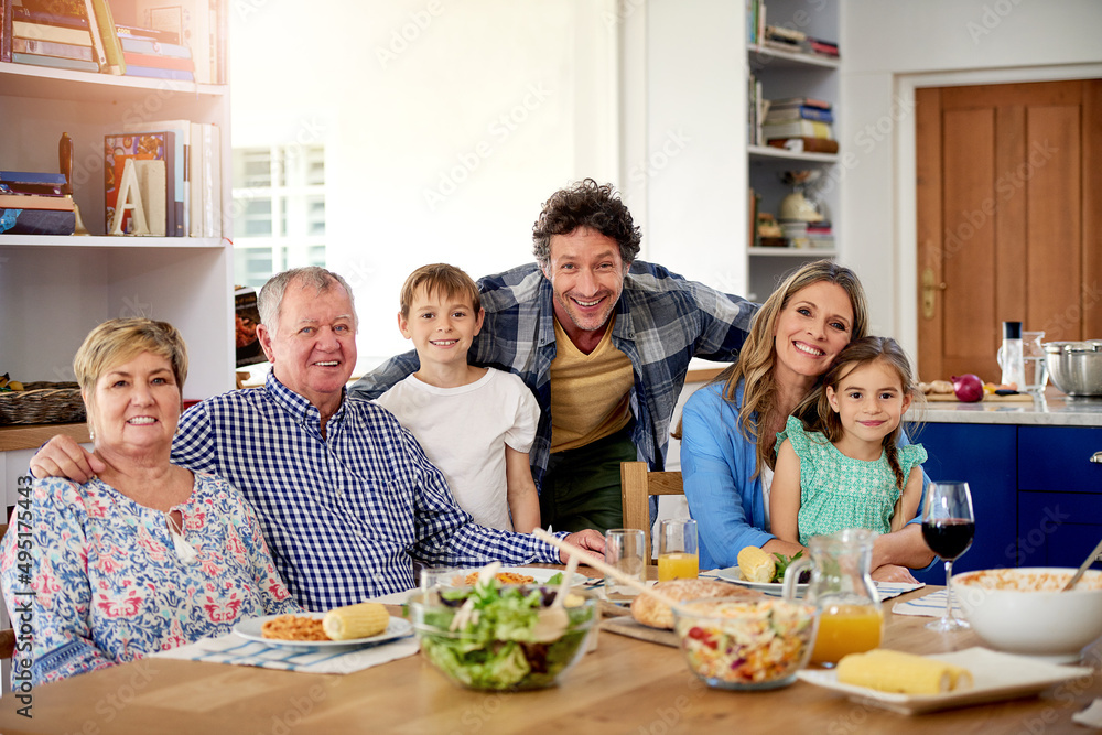 Good times are always on the menu at family gatherings. Portrait of a multi generational family enjoying a meal together at home. Good times are always on the menu at family gatherings. Portrait of a multi generational family enjoying a meal together at home.