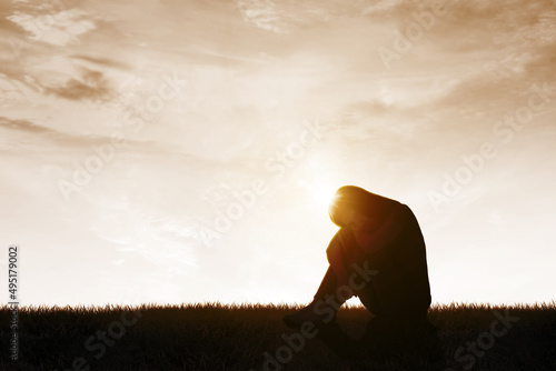 Fotografia Depressed woman sitting on the meadow
