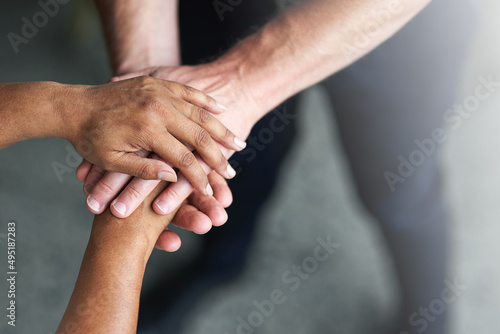 The birth of a team. Cropped shot of two peoples hands together in unity.