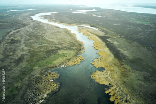 steppe plain landscape lake in the middle of fields