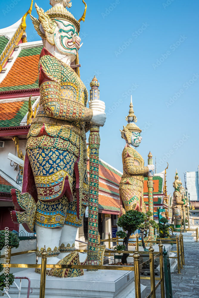 The giants statue in Wat Pra Kaew temple, The Grand Palace, blue sky, Thailand. Travel in Asia concept.