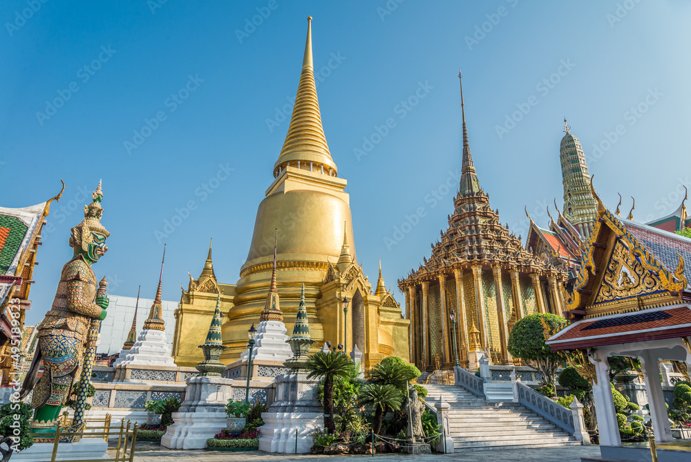 Fototapeta premium Wat Pra Kaew, The Grand Palace, blue sky background, Thailand. Travel in Asia concept.