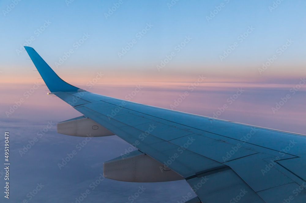 View of the wing of a passenger aircraft during the flight.