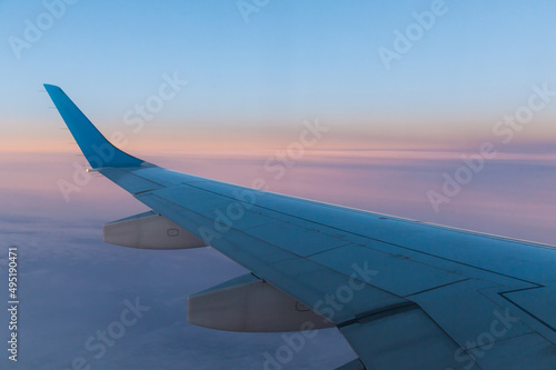 View of the wing of a passenger aircraft during the flight.