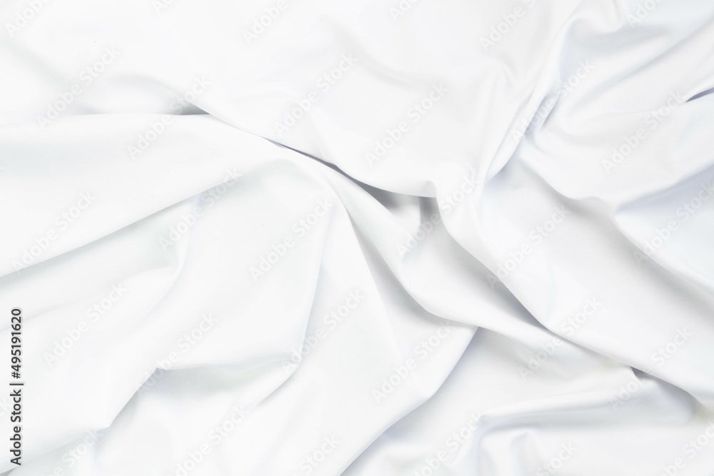 White fabric texture that is white cloth surface background with beautiful soft blur pattern.