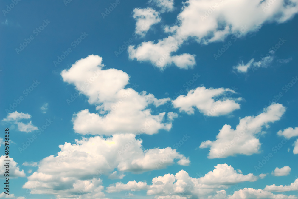 Fototapeta premium Blue sky, white clouds with yellow spots