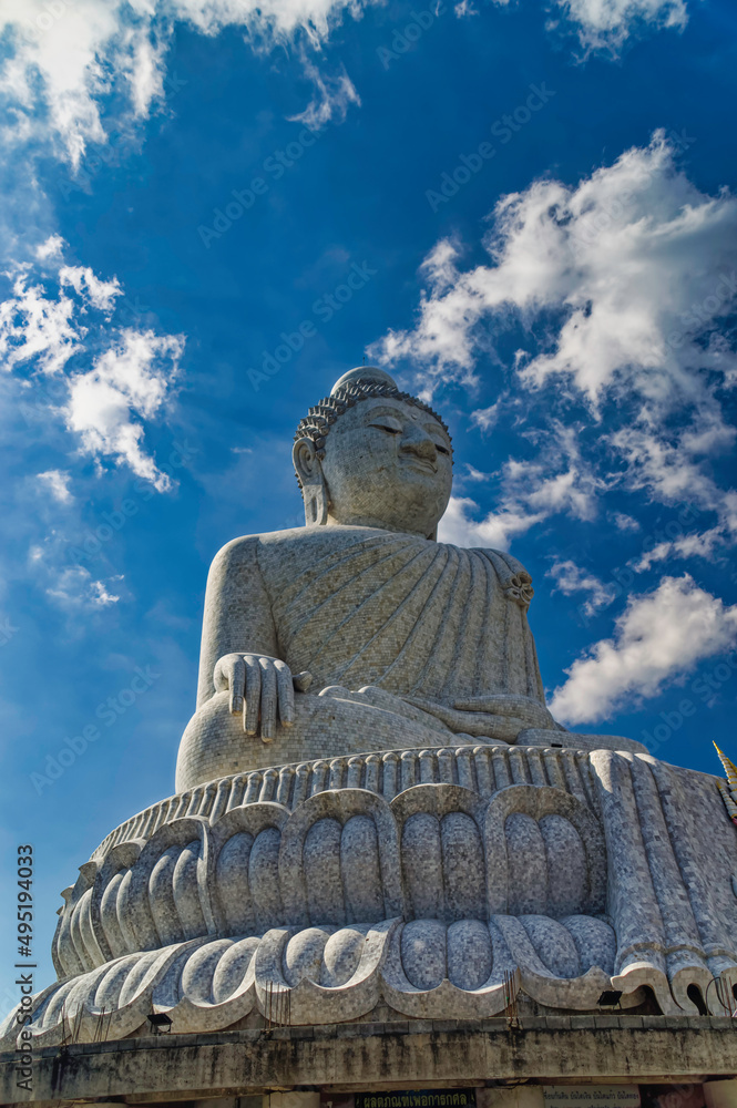 Side view over The Big Buddha or Great Buddha of Phuket, a marble made seated Maravija Buddha statue at Phuket, Thailand.