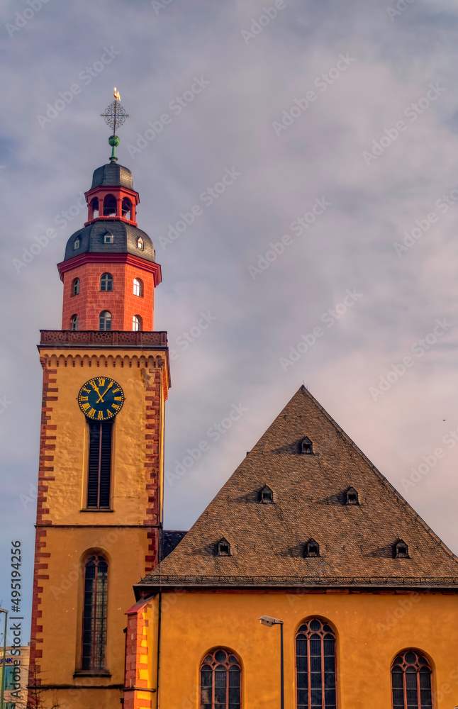 Old church with clock tower in downtown in Frankfurt am Main, Germany. Old church with clock tower in downtown in Frankfurt am Main, Germany.