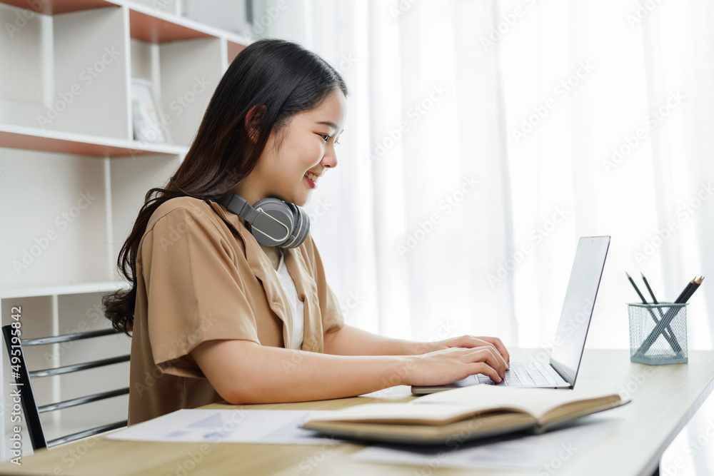 Online lifestyle concept A female staff getting ready to participate in the online meeting with her boss and colleagues. Online lifestyle concept A female staff getting ready to participate in the online meeting with her boss and colleagues.