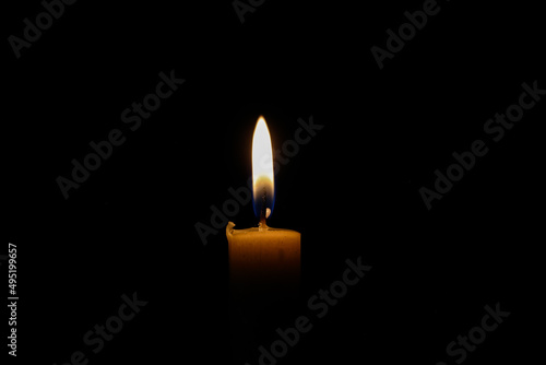 wax candle flame light glowing with out flickering silent in the dark
