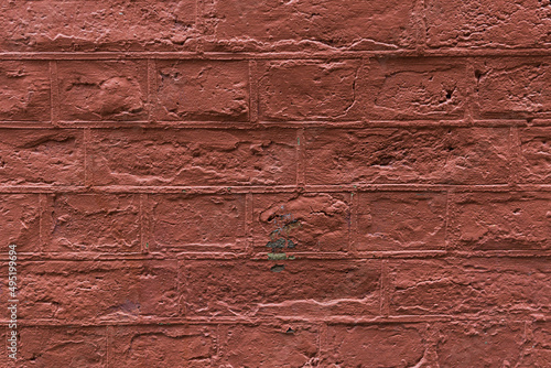 The texture of painted brick wall in red.