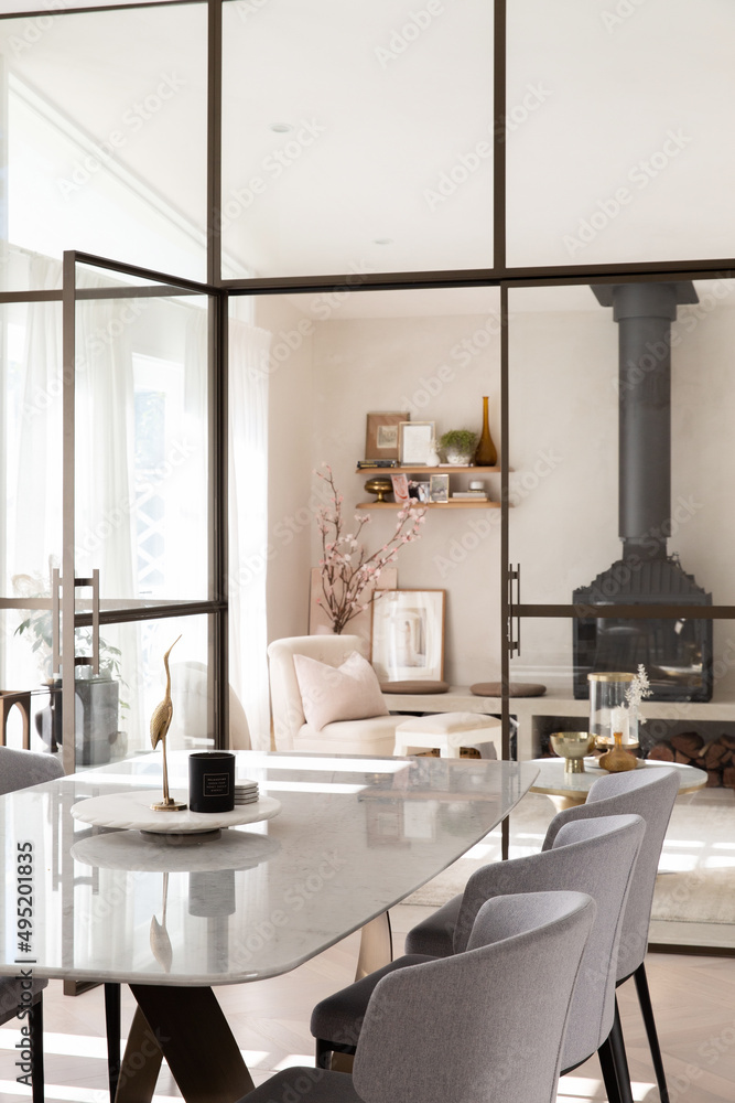Modern charming dining and living room separated by steel door Modern charming dining and living room separated by steel door