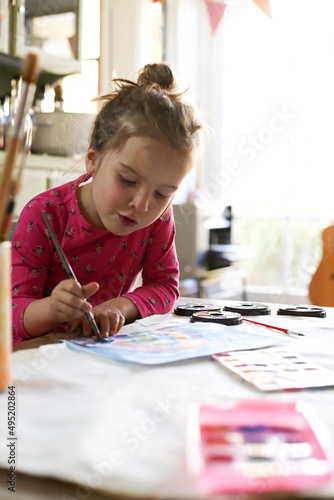 Girl doing painting photo