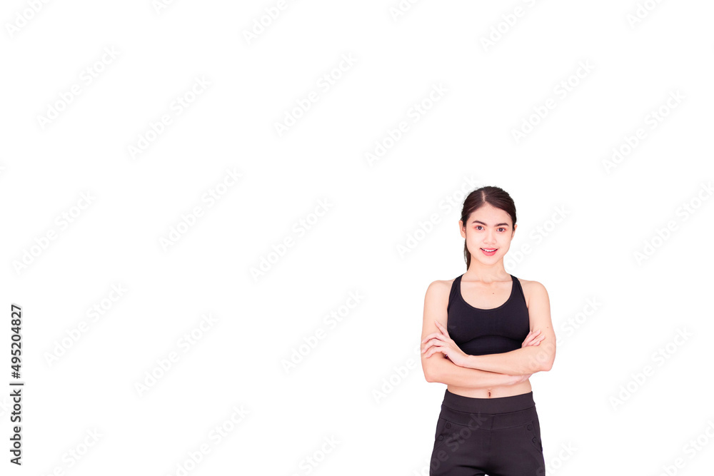 A Thai Southeast Asian woman wearing black workout clothes and smiling and crossing her arms. isolated on a white background A Thai Southeast Asian woman wearing black workout clothes and smiling and crossing her arms. isolated on a white background