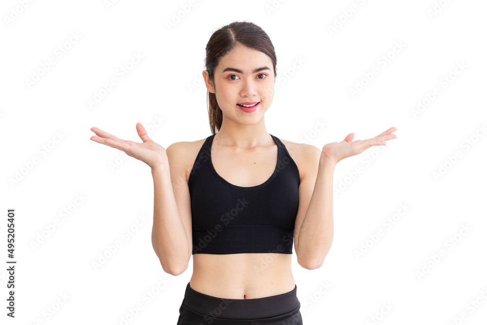 A Thai Southeast Asian woman wearing black exercise clothes is smiling and raising her hand. isolated on a white background A Thai Southeast Asian woman wearing black exercise clothes is smiling and raising her hand. isolated on a white background