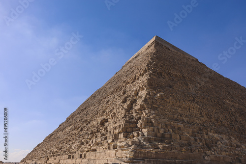 Natural View to the Great Pyramid of Giza under Blue Sky and Day Light - is the oldest and largest of the pyramids in the Giza pyramid complex, Egypt