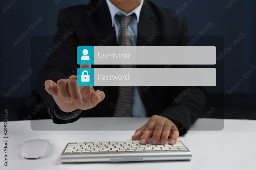 Fototapeta premium Man using login interface on touch screen. Touching login box, username and password inputs on digital display. Copy space.