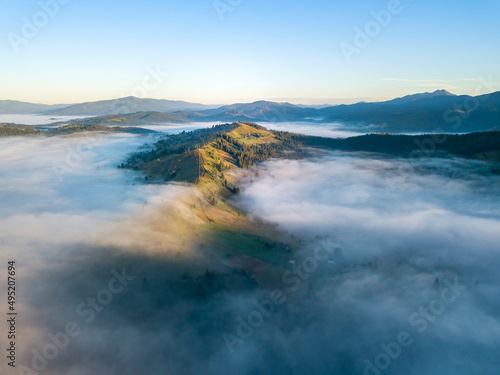 Morning fog in the Ukrainian Carpathians. Aerial drone view.