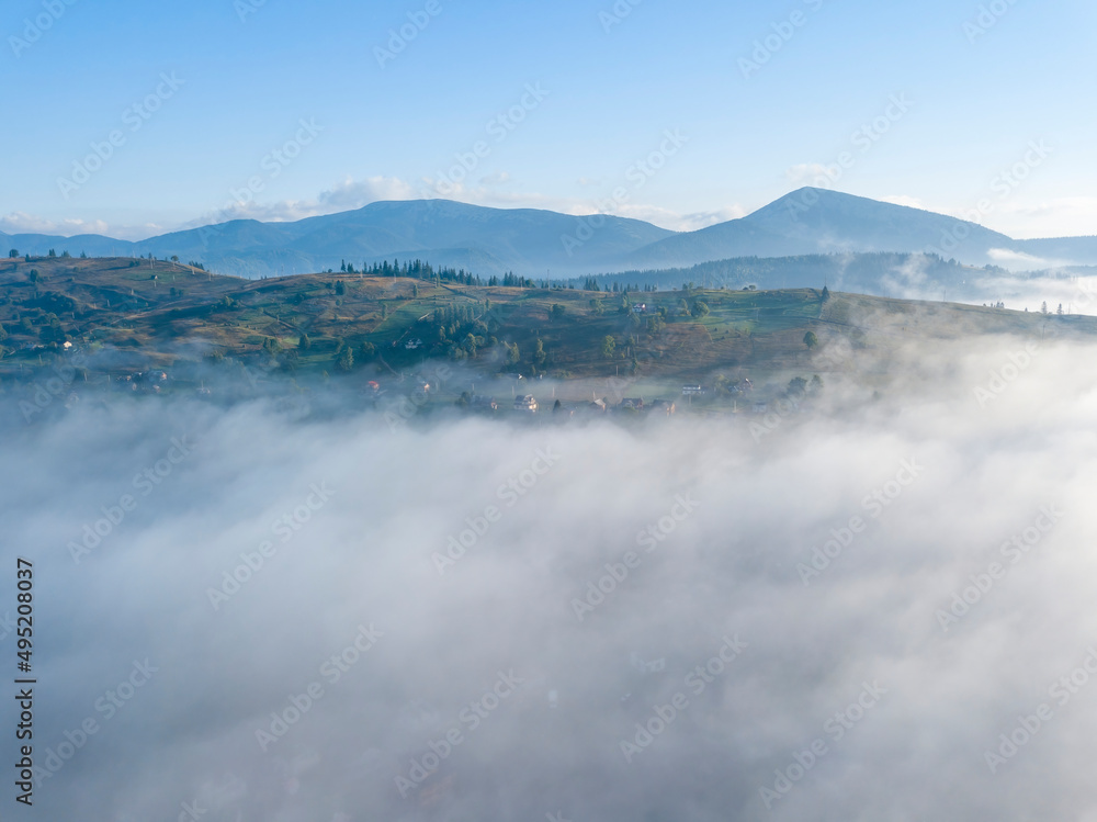 Morning fog in the Ukrainian Carpathians. Aerial drone view.