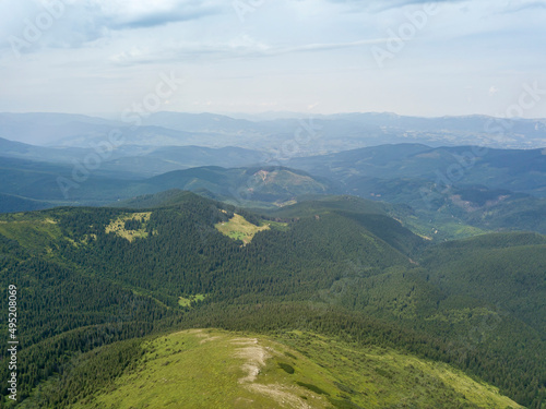High mountains of the Ukrainian Carpathians in cloudy weather. Aerial drone view. © Sergey