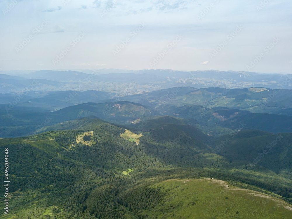High mountains of the Ukrainian Carpathians in cloudy weather. Aerial drone view.
