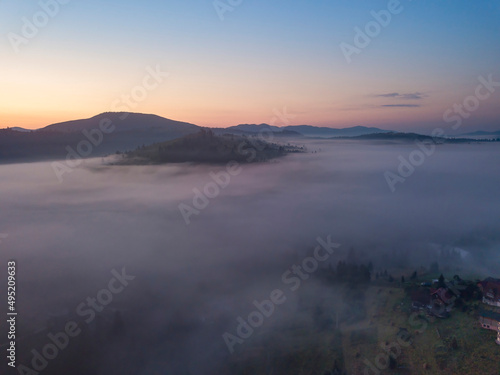 Morning fog in the Ukrainian Carpathians. Aerial drone view.