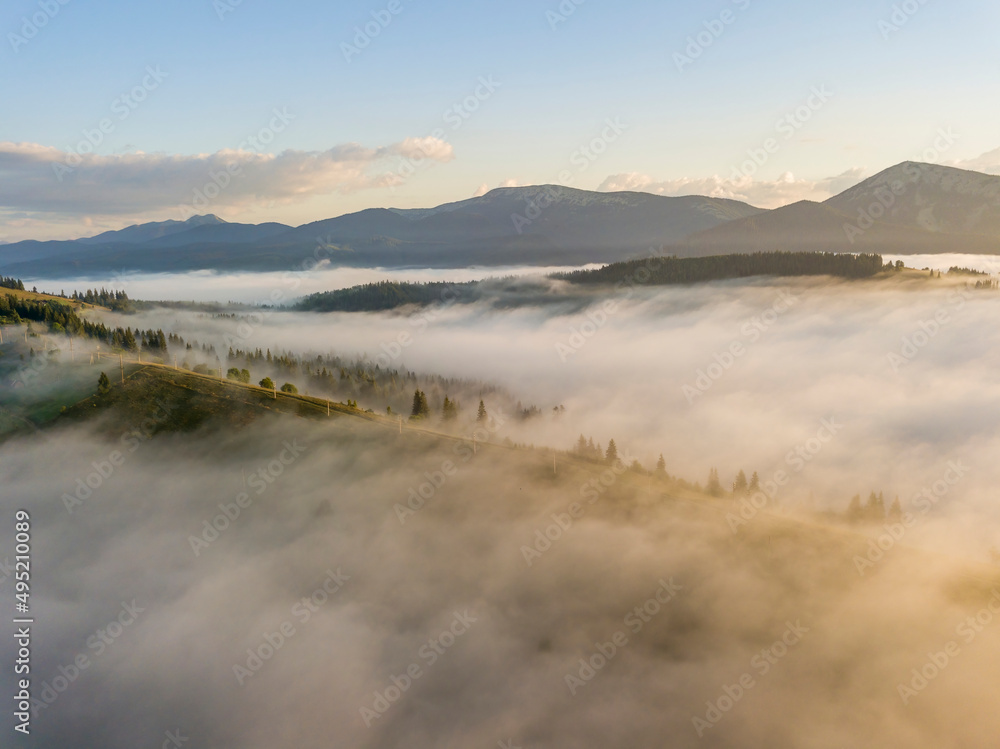 Morning fog in the Ukrainian Carpathians. Aerial drone view.