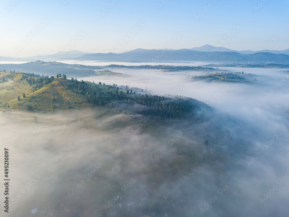 Morning fog in the Ukrainian Carpathians. Aerial drone view. Morning fog in the Ukrainian Carpathians. Aerial drone view.