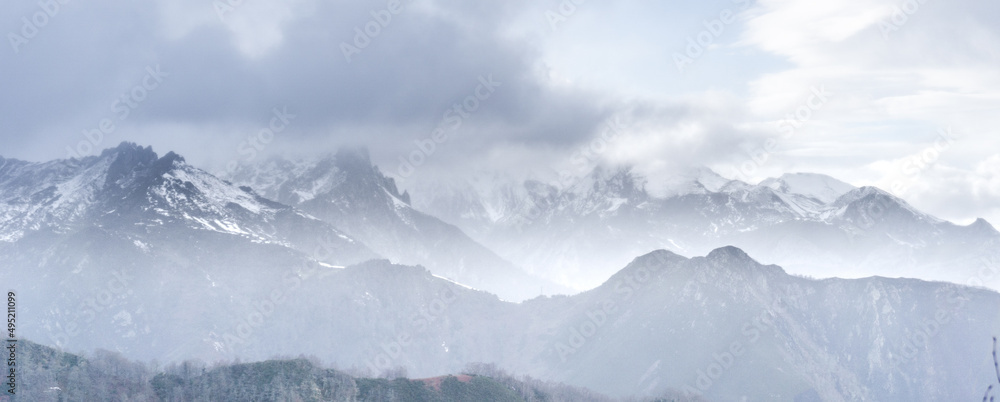 High mountain scenery covered by clouds 