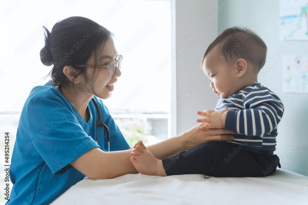 Happy Asian doctor or pediatrician checking baby patient at clinic Happy Asian doctor or pediatrician checking baby patient at clinic