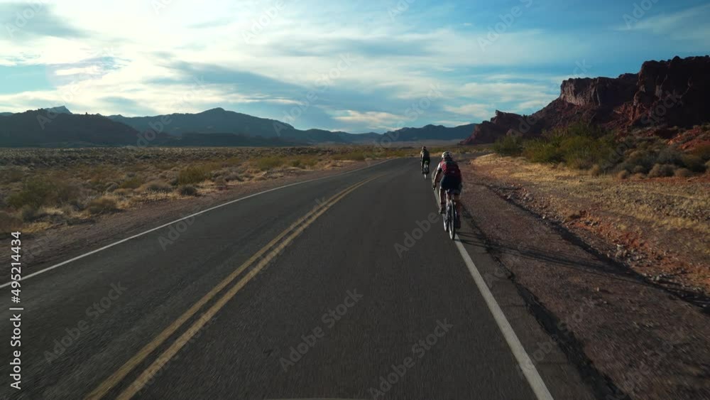 Biking with mountains in the background Biking with mountains in the background