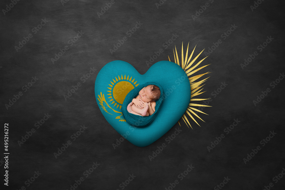 Newborn portrait on heart in color of national flag. Photography peace concept. Kazakhstan